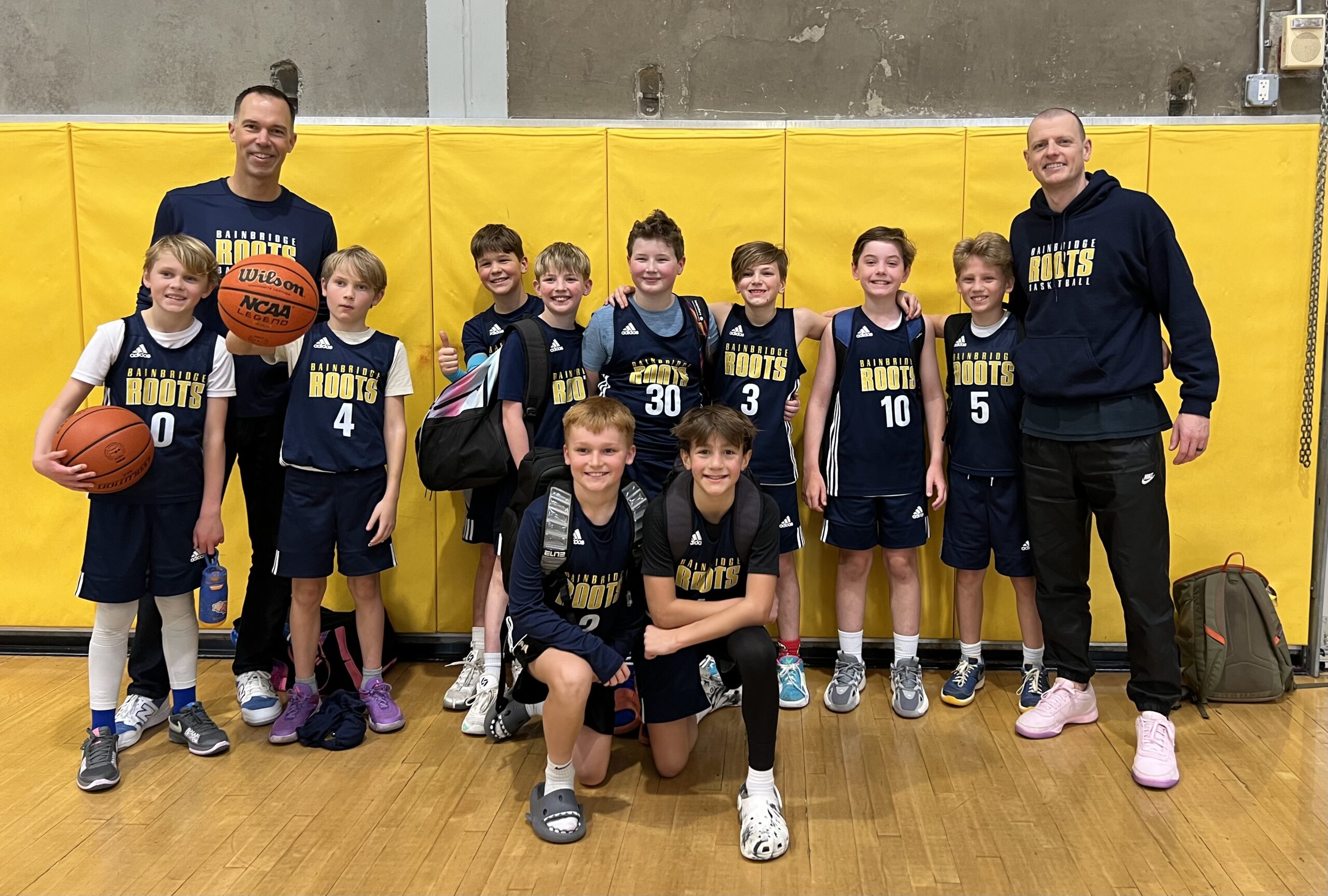 Roots 5th Grade team Youth basketball team posing for a photo.